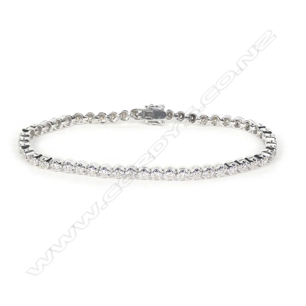 A 9ct white gold and diamond tennis bracelet Image 1++