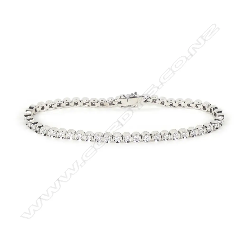 An 18ct white gold and diamond tennis bracelet Image 1++