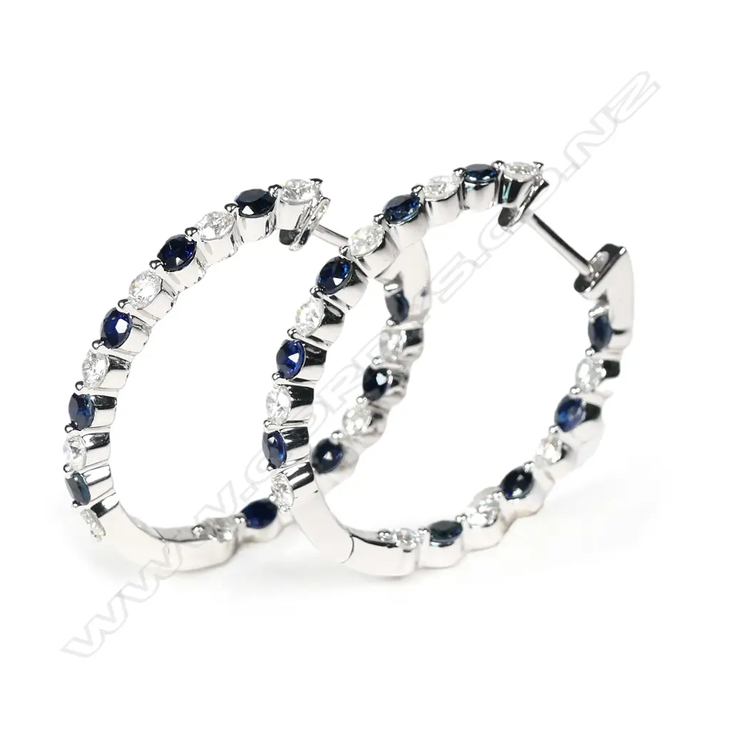 A pair of 14ct white gold sapphire and diamond hoop earrings Image 1++