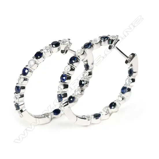 A pair of 14ct white gold sapphire and diamond hoop earrings