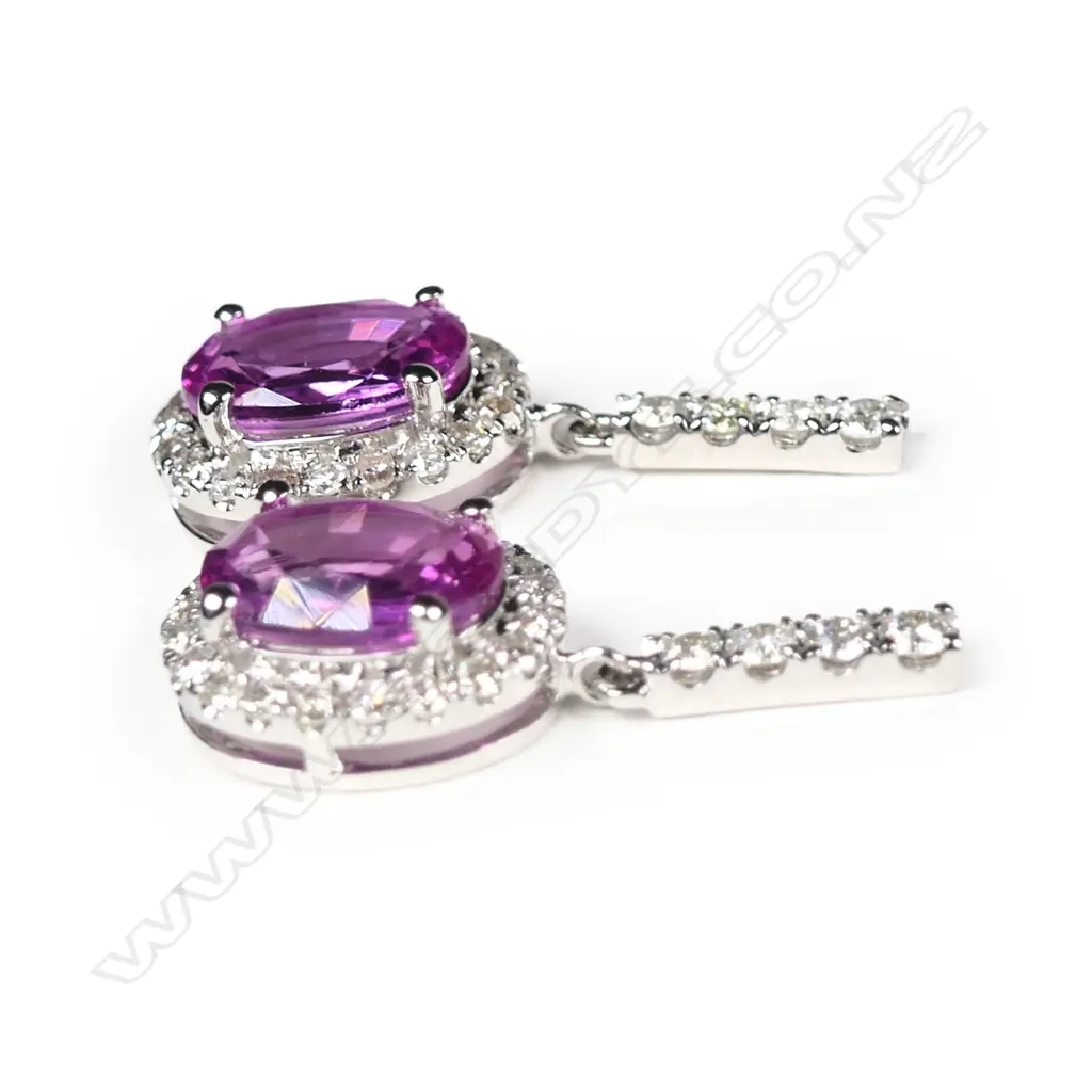 A pair of 14ct white gold sapphire and diamond drop earrings Image 1++