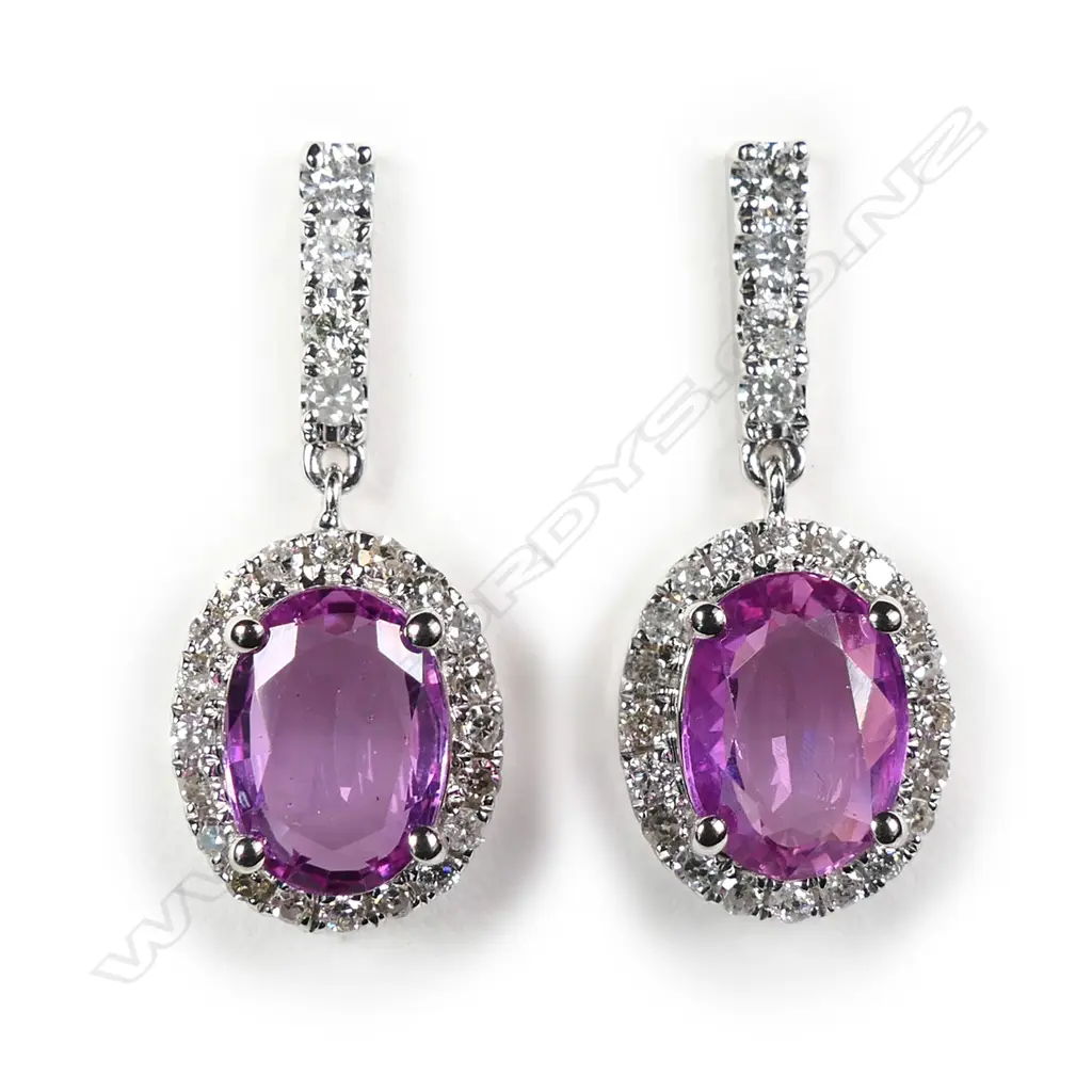 A pair of 14ct white gold sapphire and diamond drop earrings Image 1++