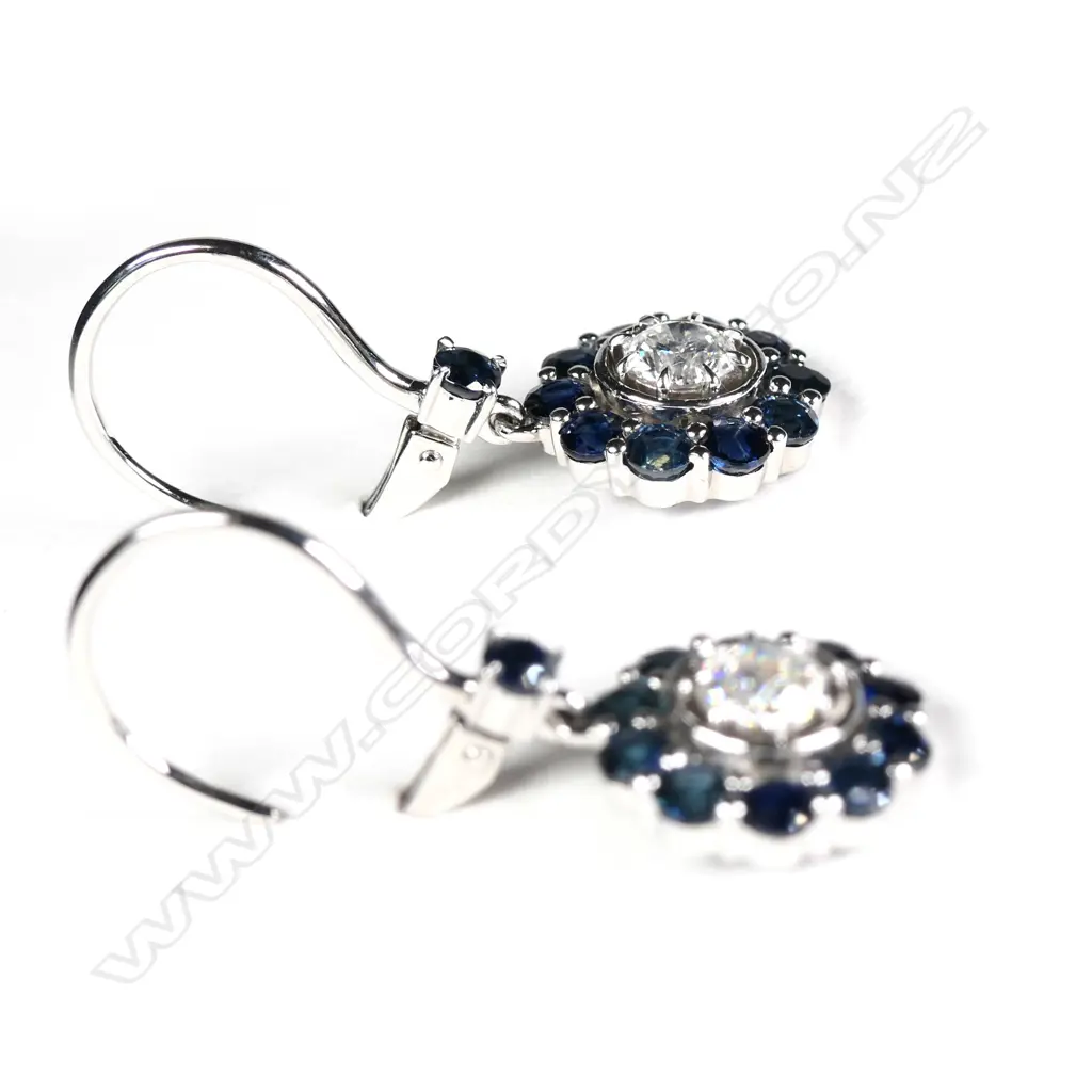 A pair of 14ct white gold sapphire and diamond drop earrings Image 1++