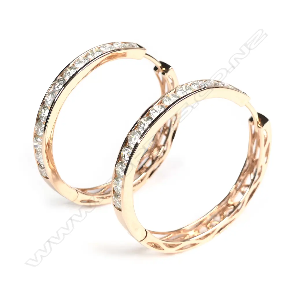 A pair of 14ct rose gold diamond hoop earrings Image 1++