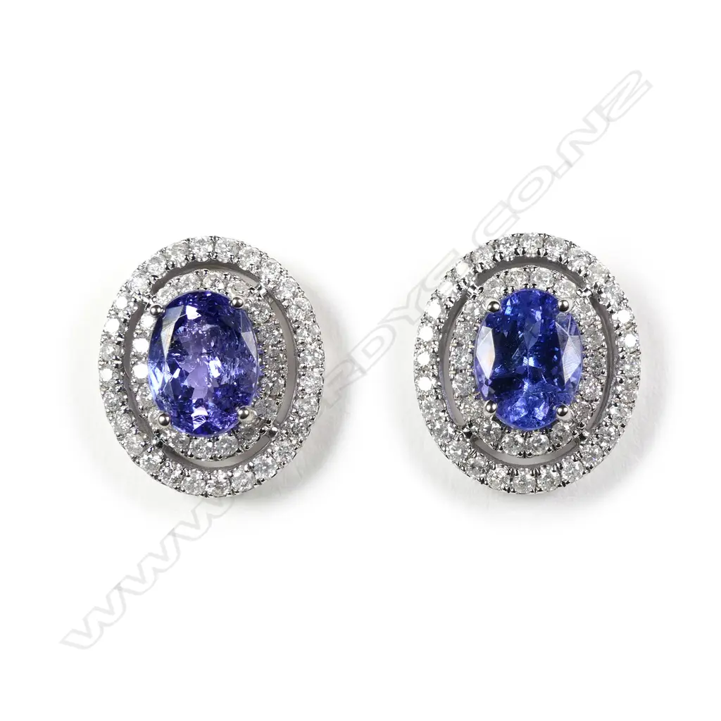 A pair of 14ct white gold tanzanite and diamond double halo stud earrings Image 1++