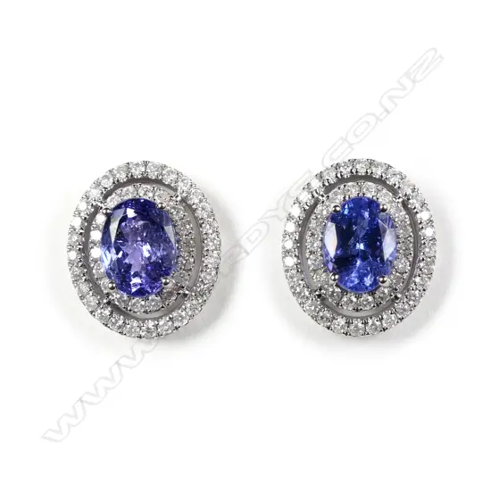 A pair of 14ct white gold tanzanite and diamond double halo stud earrings