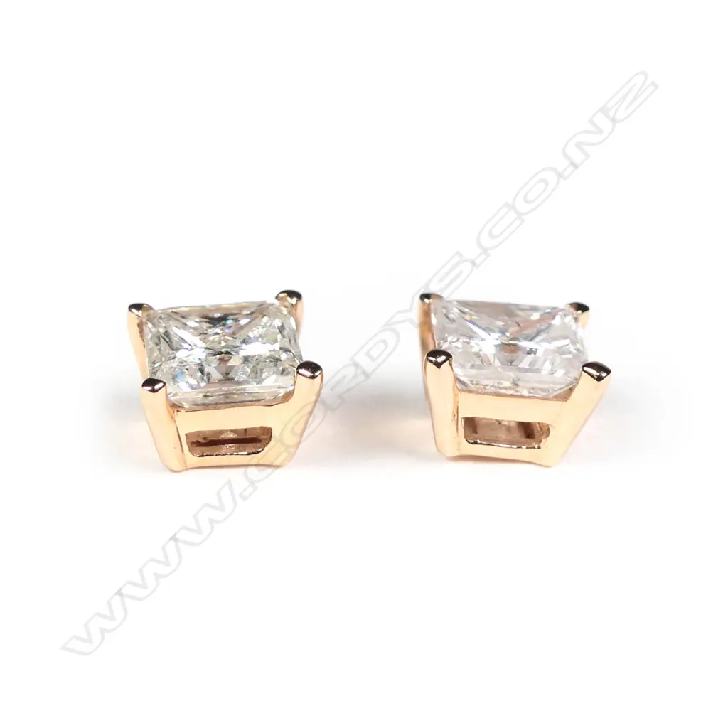 A pair of 14ct rose gold diamond stud earrings Image 1++