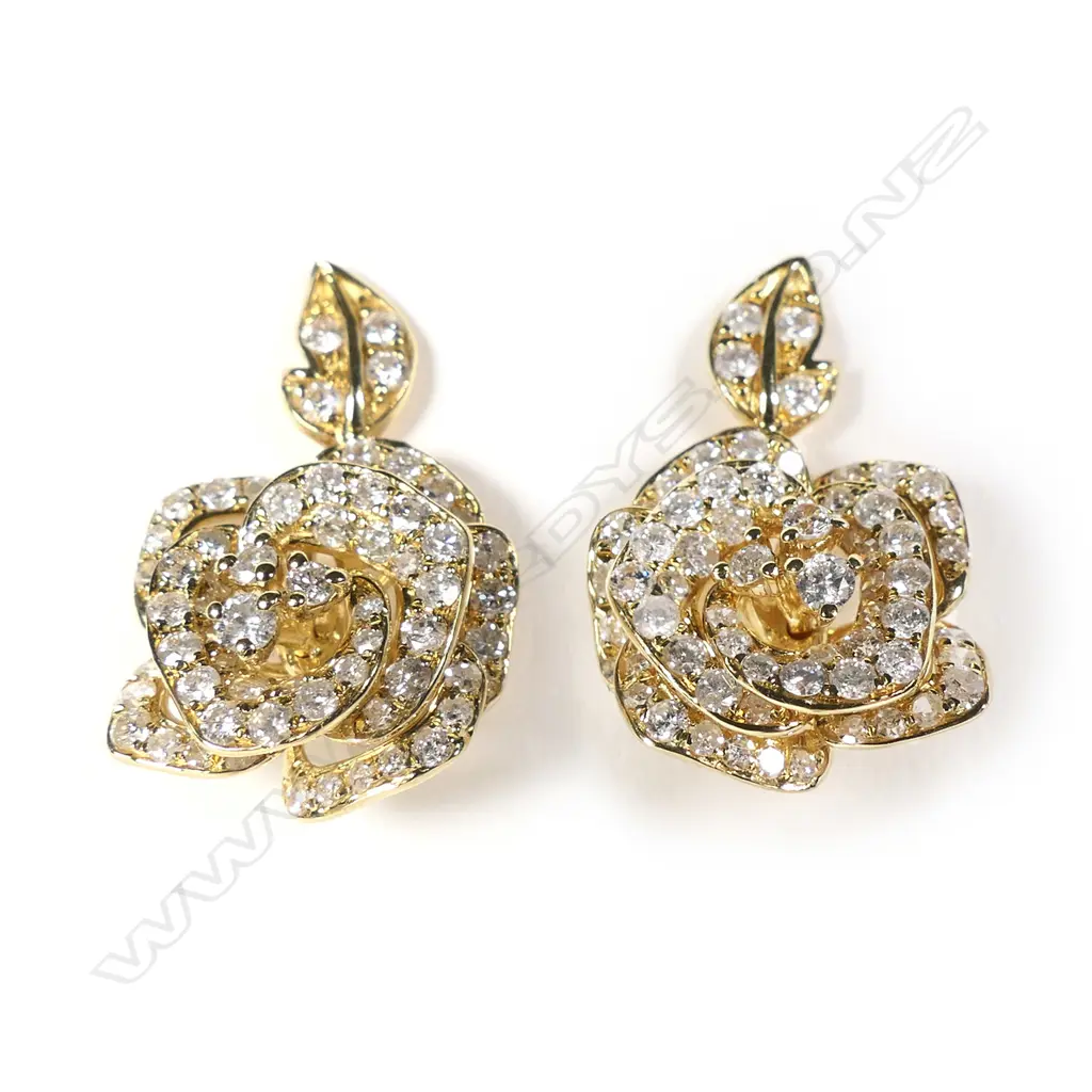 A pair of 18ct gold and diamond earrings Image 1++