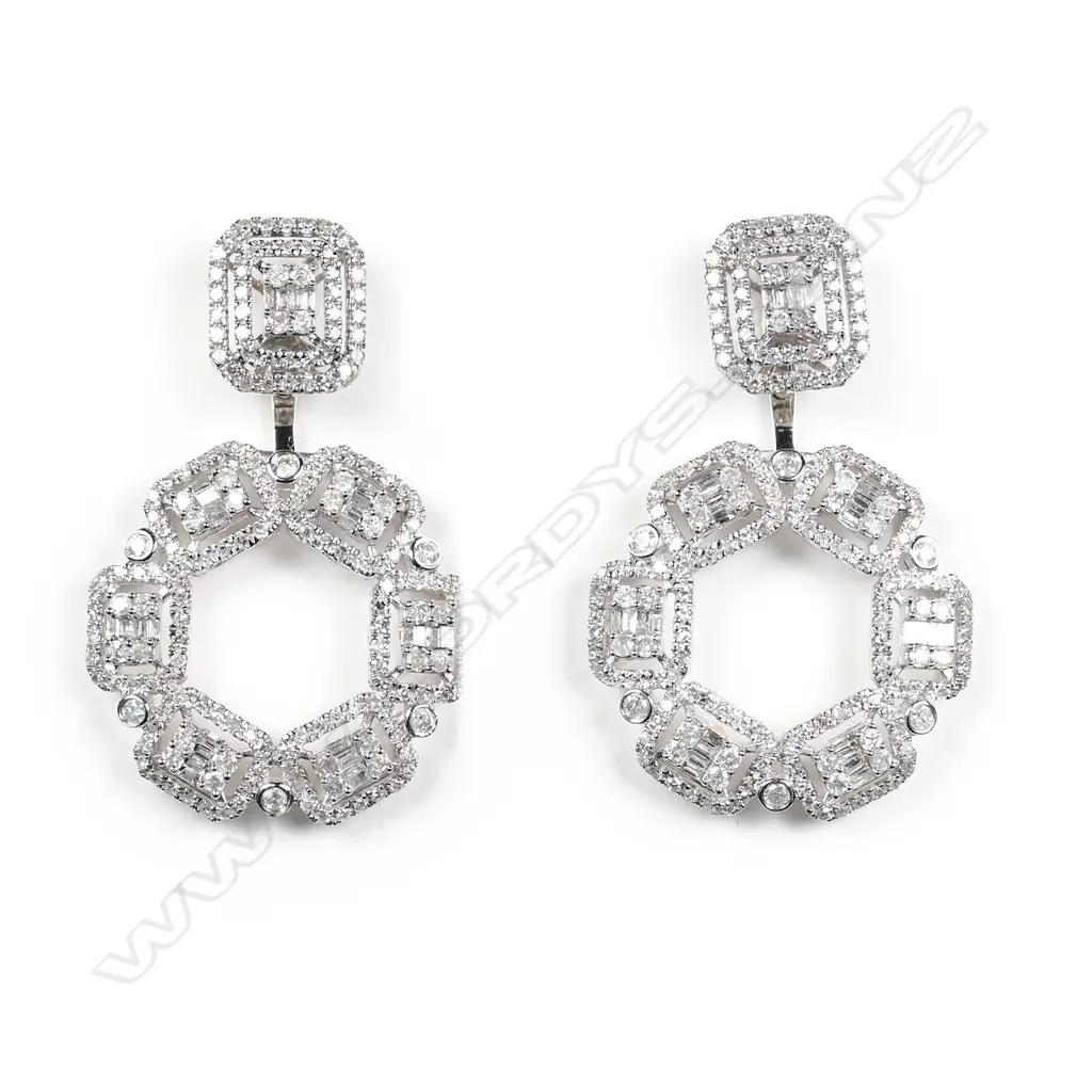 A pair of 18ct white gold and diamond earrings Image 1++