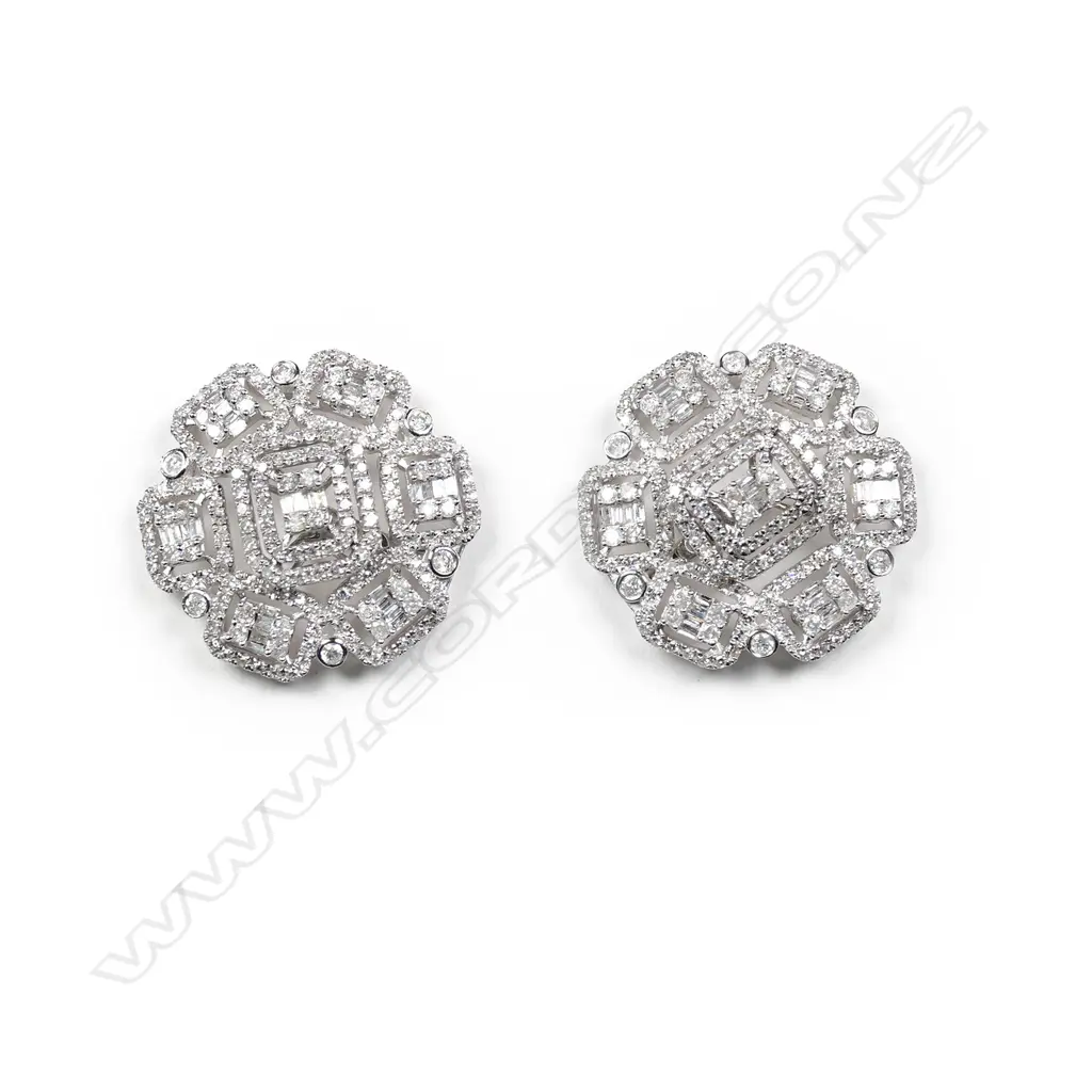 A pair of 18ct white gold and diamond earrings Image 1++