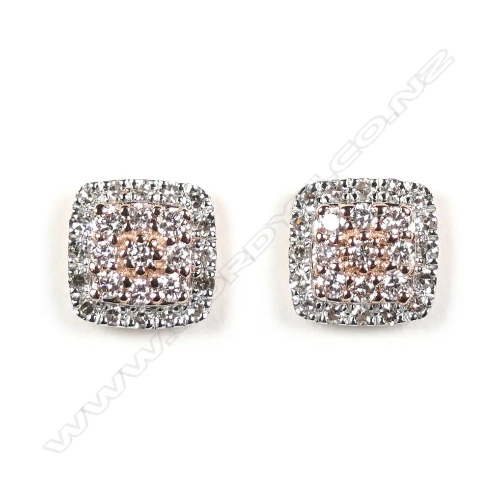 A pair of 14ct rose gold diamond stud earrings Image 1++