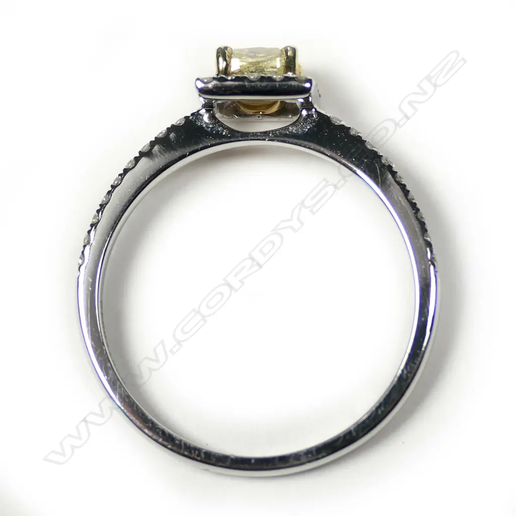 An 18ct white gold yellow and white diamond ring Image 1++