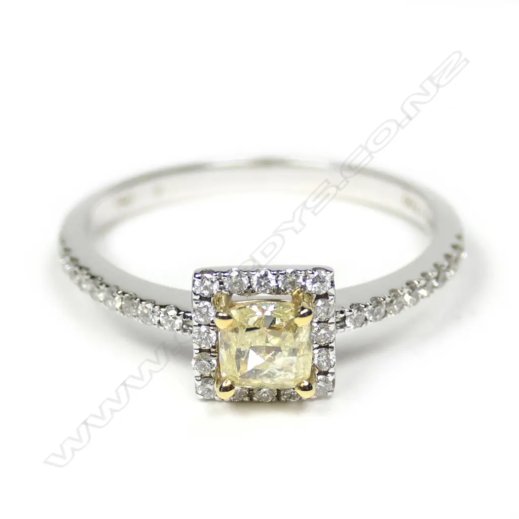 An 18ct white gold yellow and white diamond ring Image 1++
