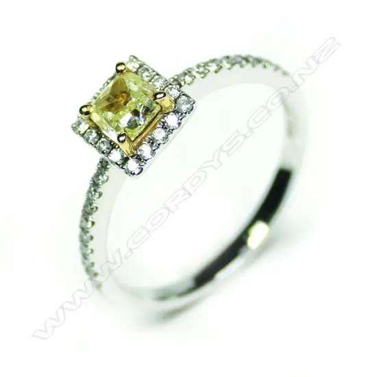 An 18ct white gold yellow and white diamond ring