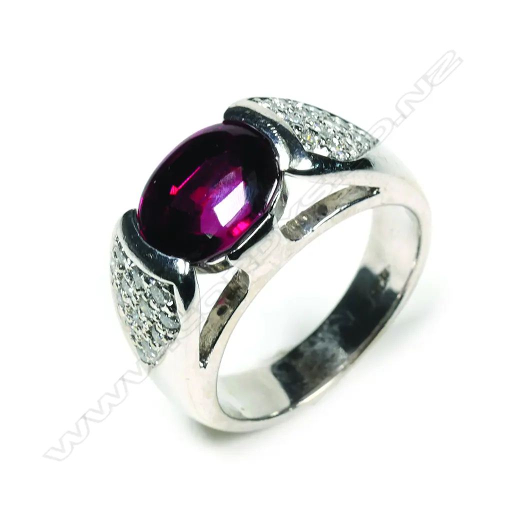 An 18ct white gold garnet and diamond ring Image 1++