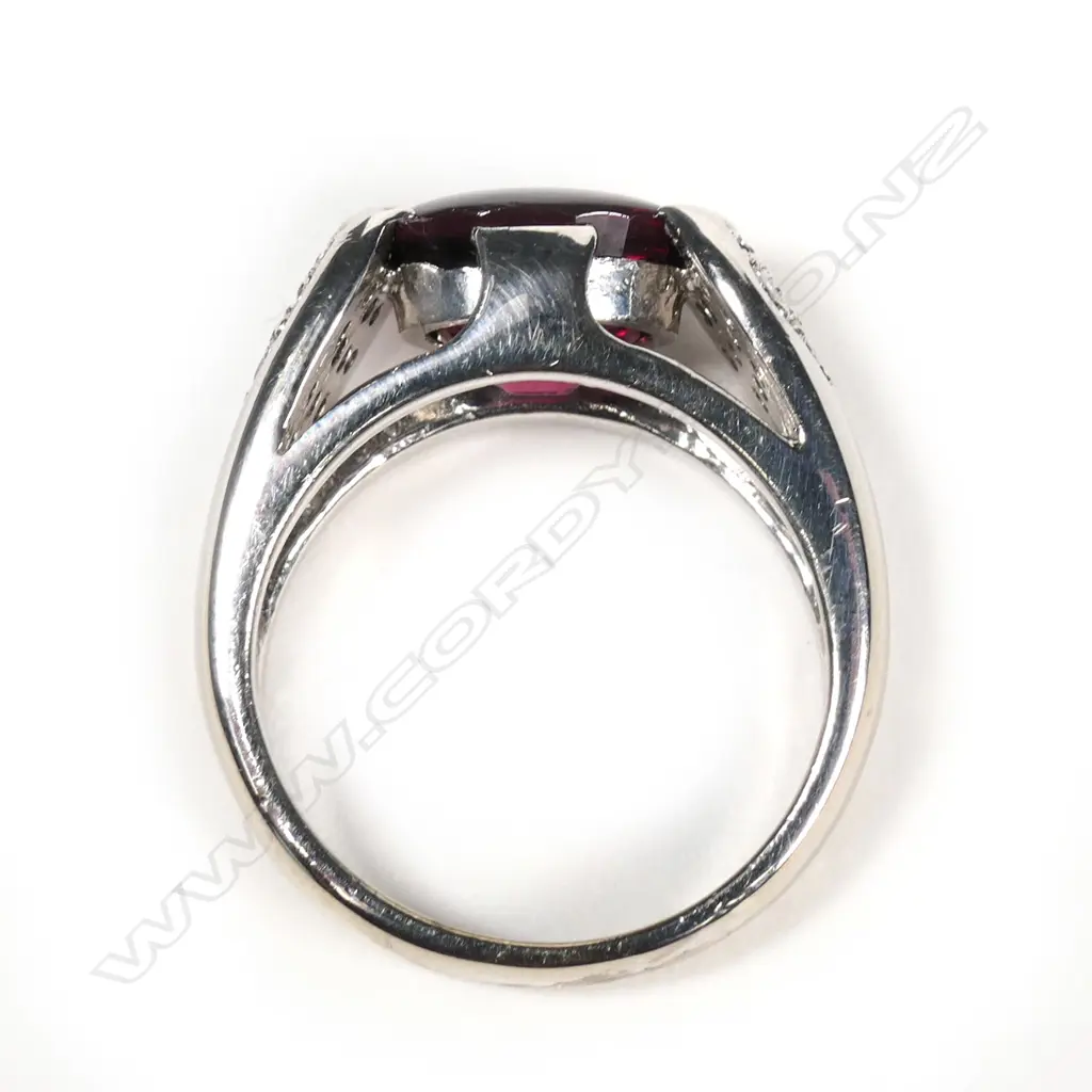 An 18ct white gold garnet and diamond ring Image 1++