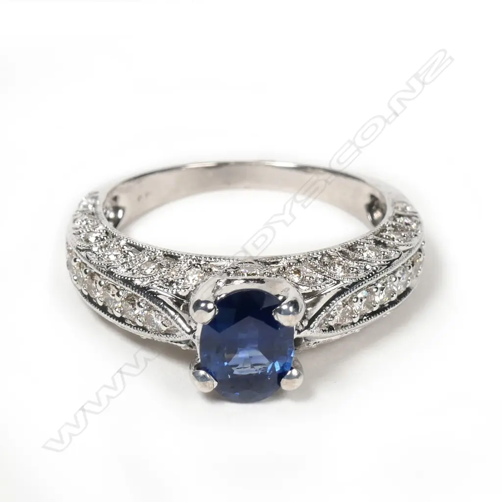 An 18ct white gold sapphire and diamond ring Image 1++