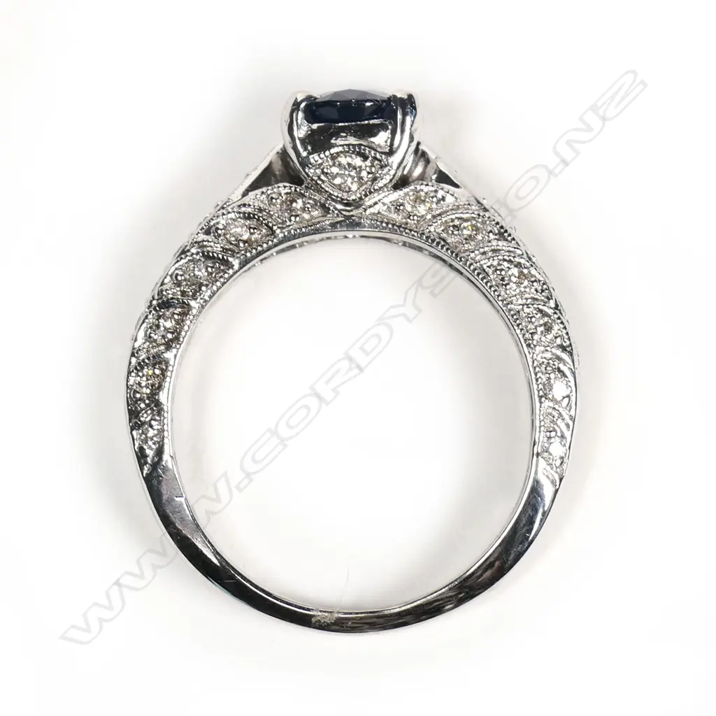 An 18ct white gold sapphire and diamond ring Image 1++