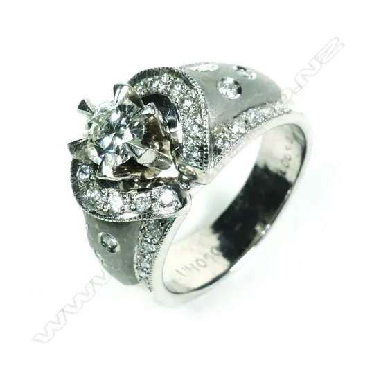 A stylish platinum and diamond dress ring