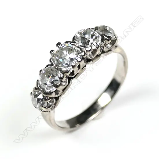 An estate 18ct five stone diamond bridge ring
