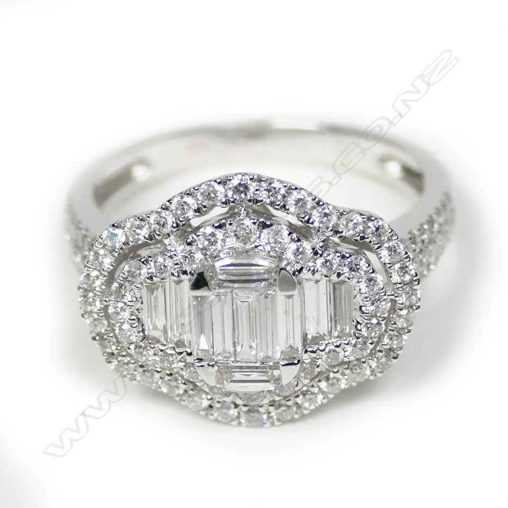 An 18ct white gold and multi diamond ring Image 1++