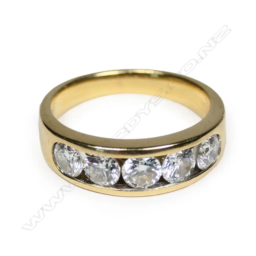 An 18ct five stone diamond ring Image 1++