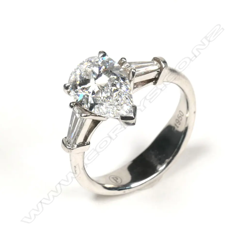A platinum and diamond solitaire ring Image 1++