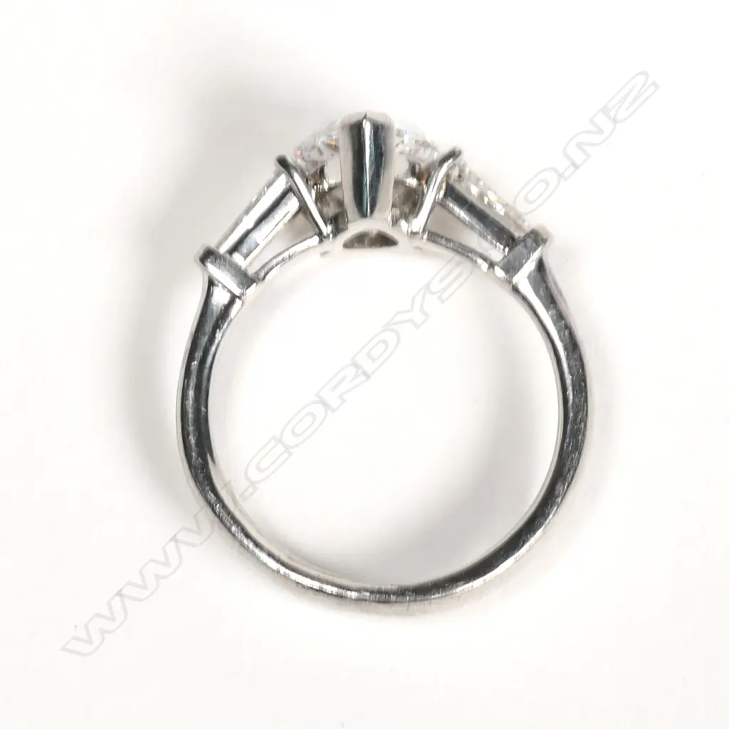 A platinum and diamond solitaire ring Image 1++