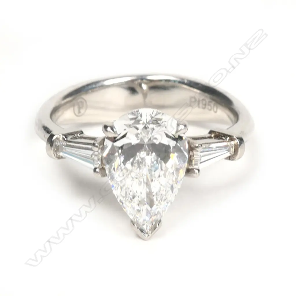A platinum and diamond solitaire ring Image 1++