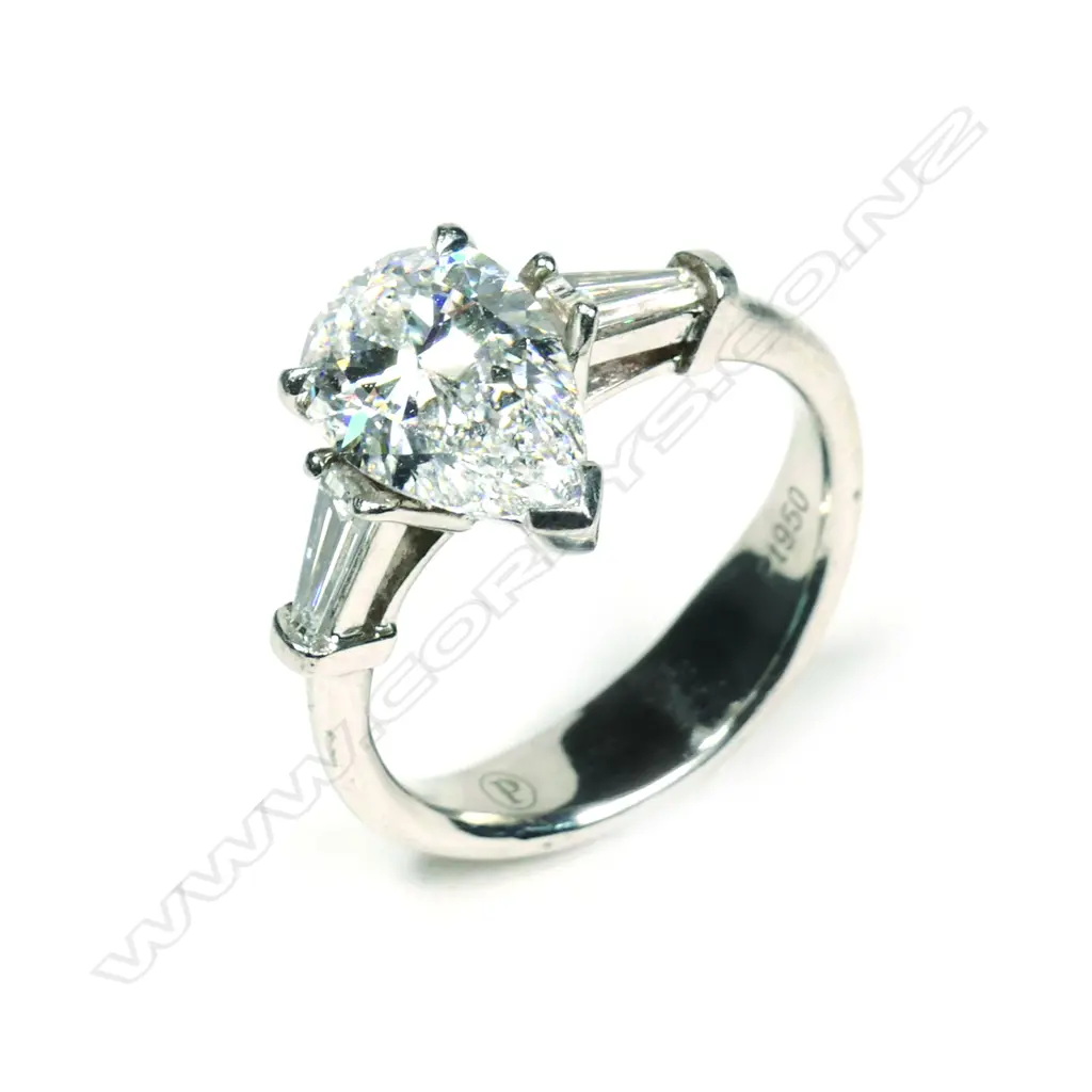 A platinum and diamond solitaire ring Image 1++