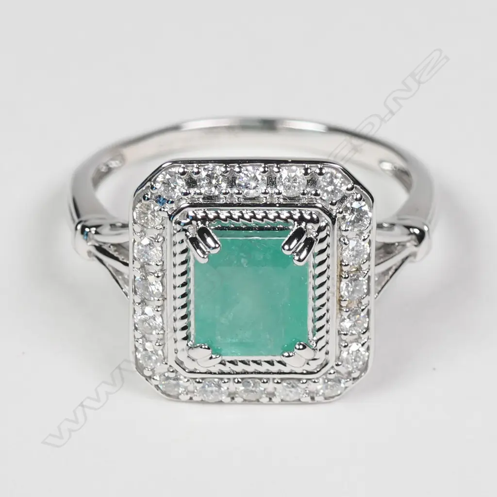 A 14ct white gold Columbian emerald and diamond ring Image 1++
