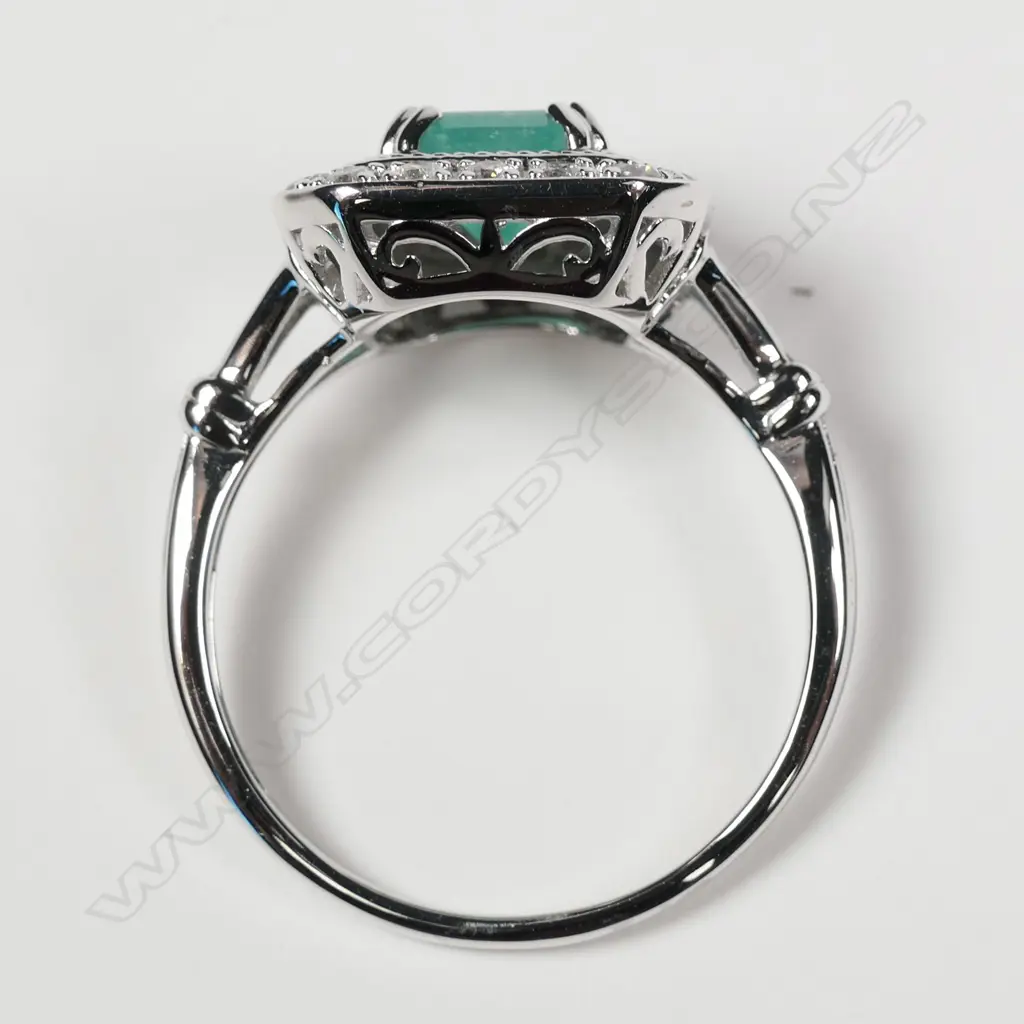 A 14ct white gold Columbian emerald and diamond ring Image 1++