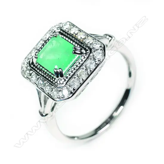 A 14ct white gold Columbian emerald and diamond ring