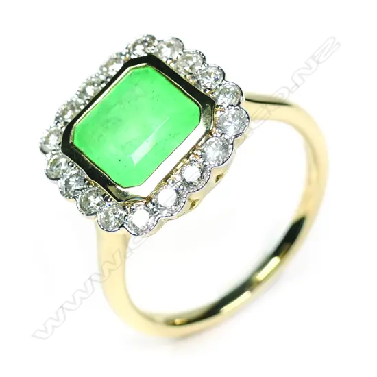A 14ct yellow gold Columbian emerald and diamond halo ring