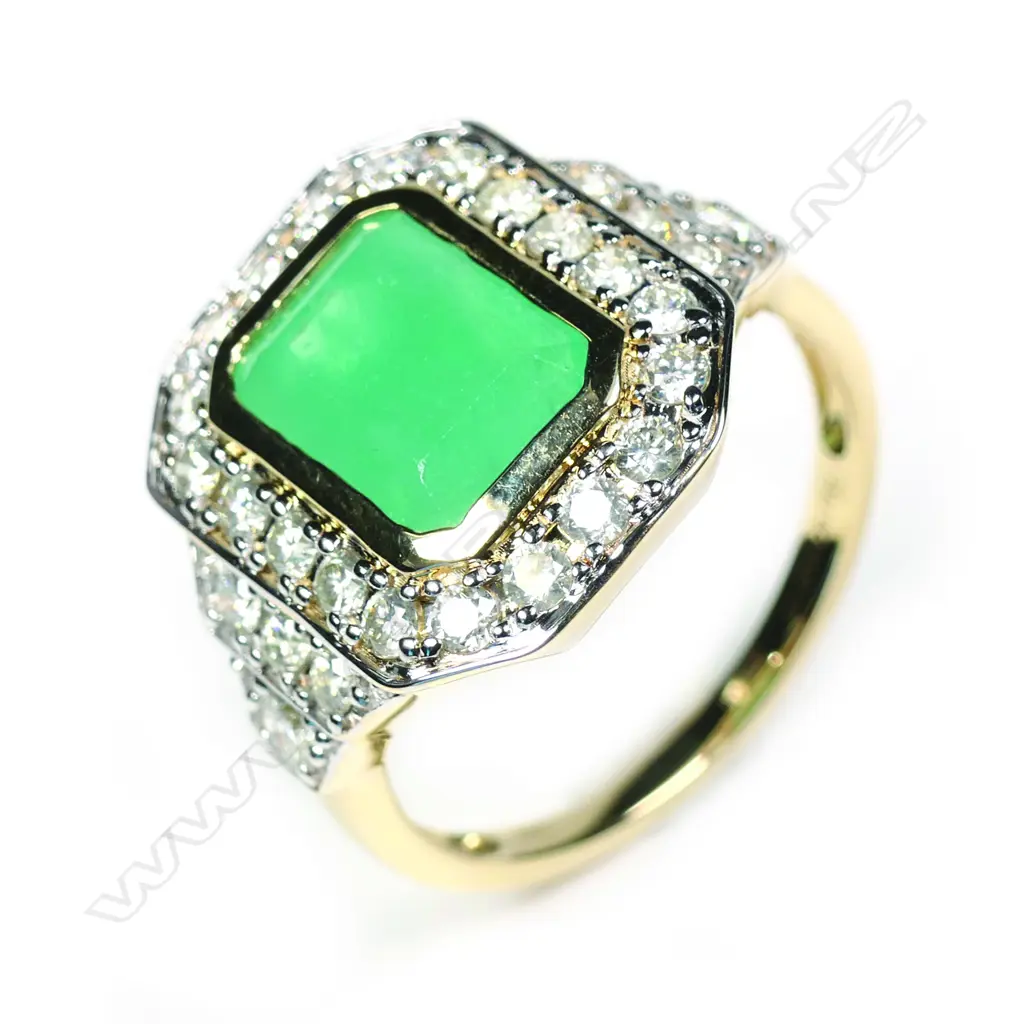 A 14ct yellow gold Columbian emerald and diamond ring Image 1++