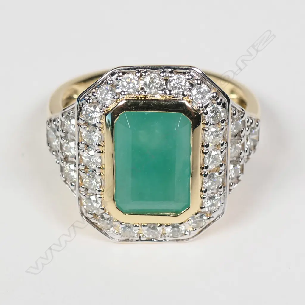 A 14ct yellow gold Columbian emerald and diamond ring Image 1++