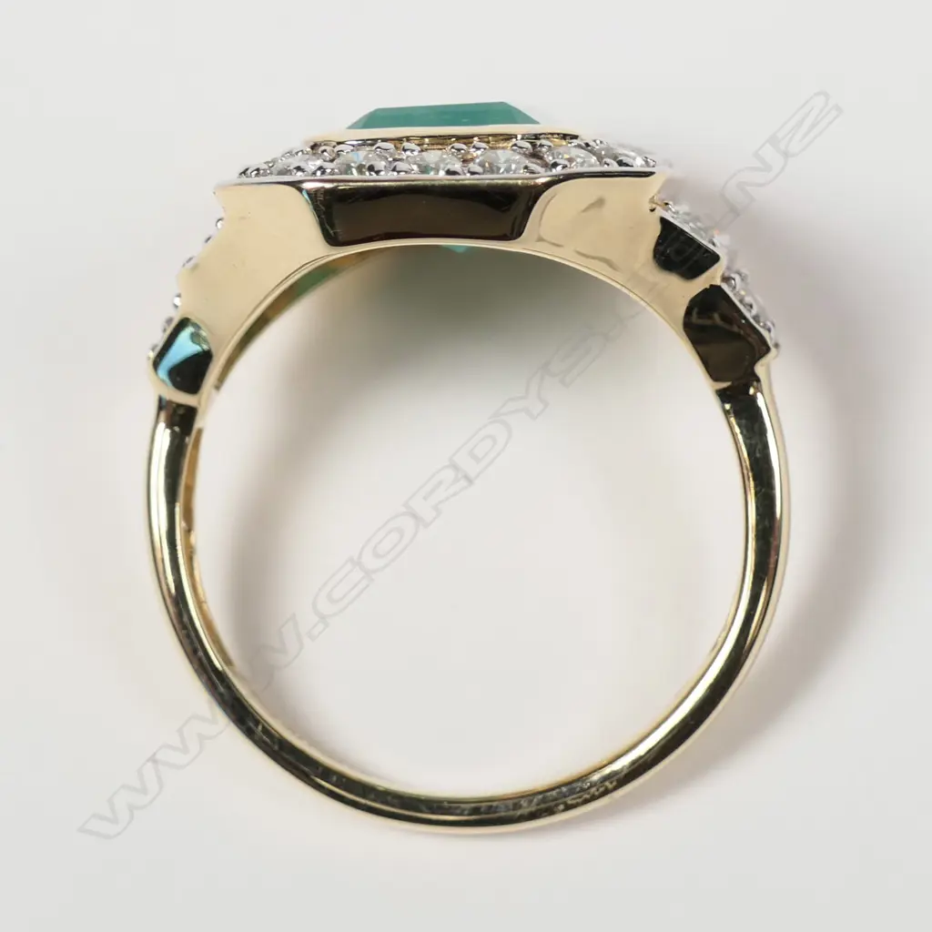 A 14ct yellow gold Columbian emerald and diamond ring Image 1++