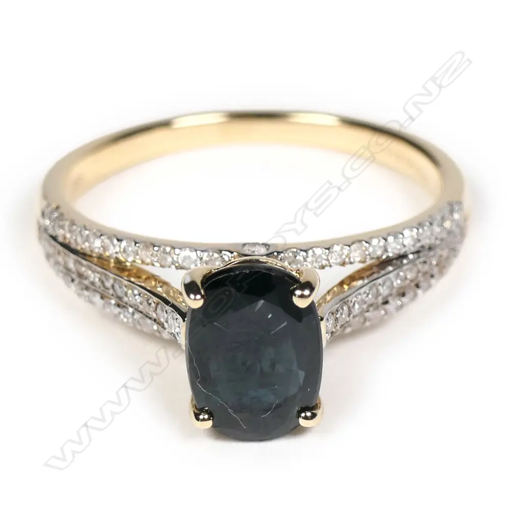 A 14ct yellow gold sapphire and diamond ring Image 1++