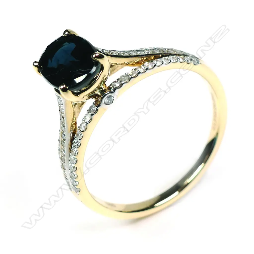 A 14ct yellow gold sapphire and diamond ring Image 1++