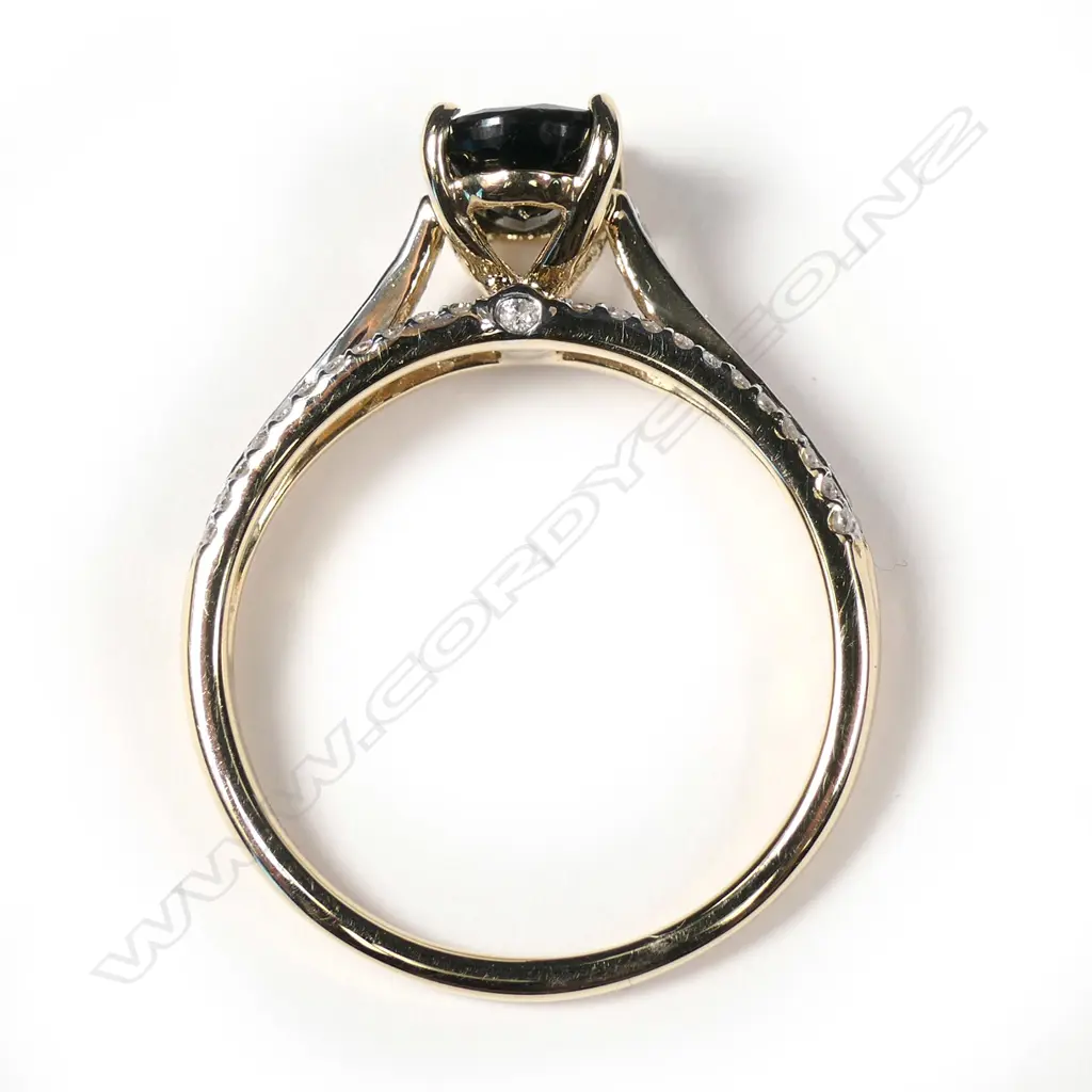 A 14ct yellow gold sapphire and diamond ring Image 1++