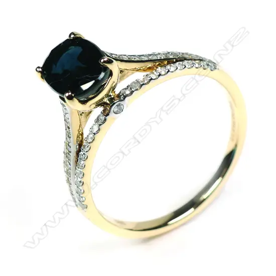 A 14ct yellow gold sapphire and diamond ring