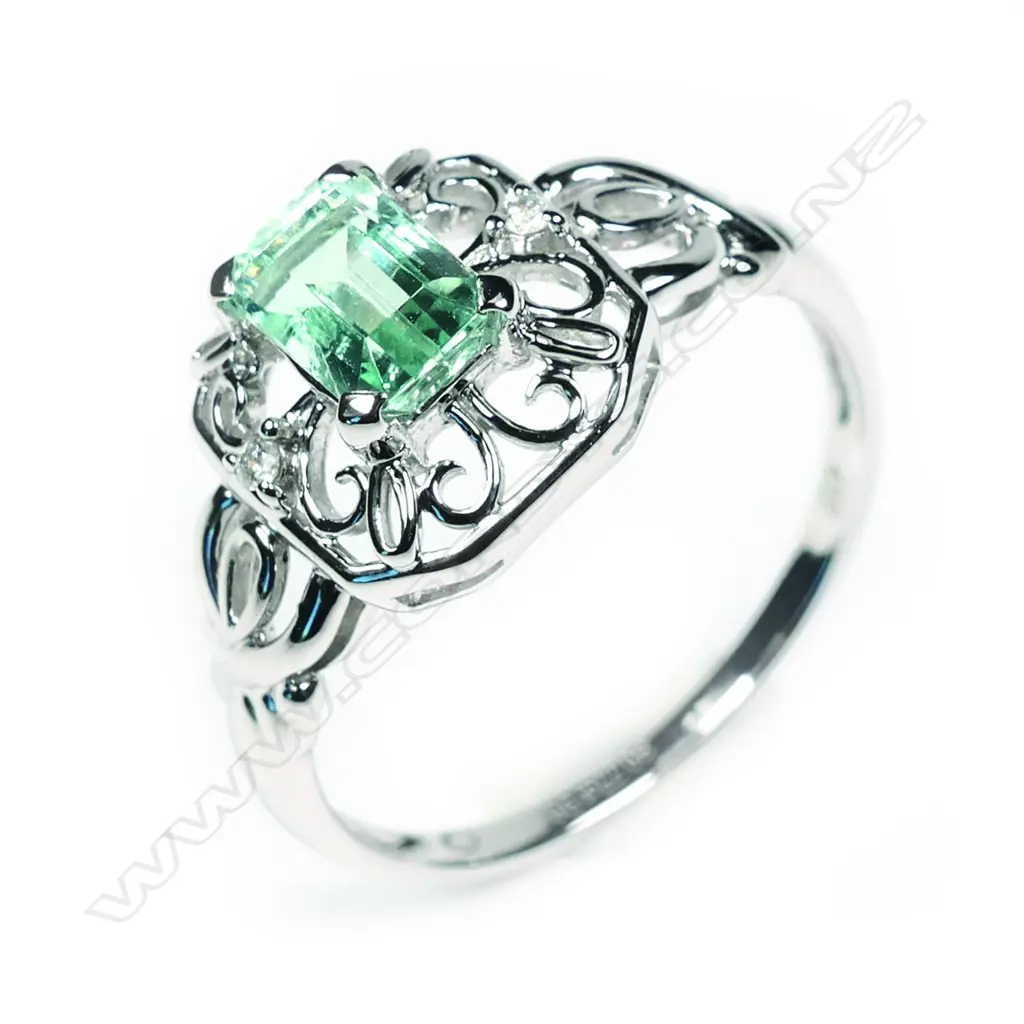 A 10ct white gold Columbian emerald and diamond filigree design ring Image 1++
