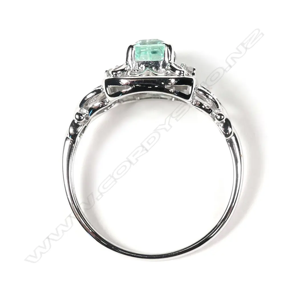 A 10ct white gold Columbian emerald and diamond filigree design ring Image 1++