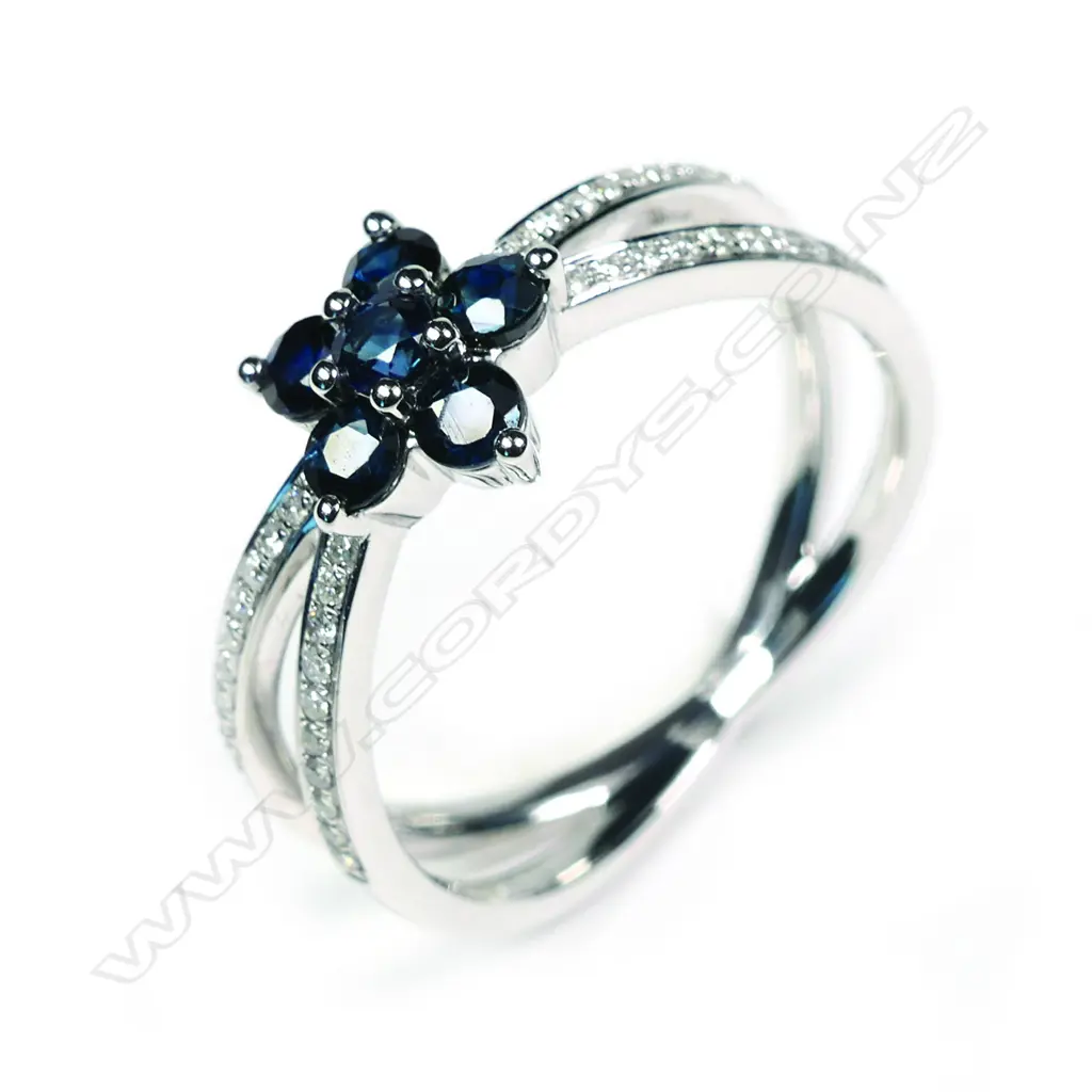 A 14ct white gold sapphire and diamond ring Image 1++