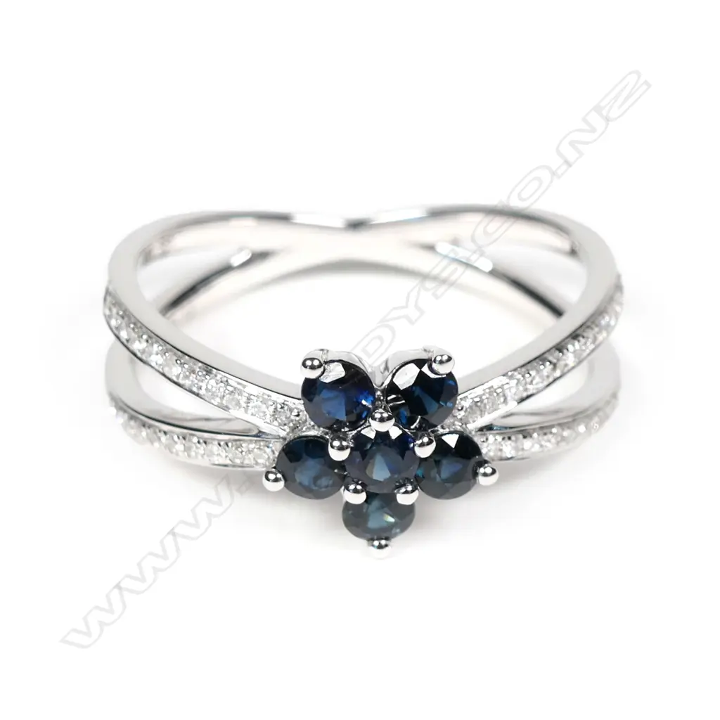 A 14ct white gold sapphire and diamond ring Image 1++