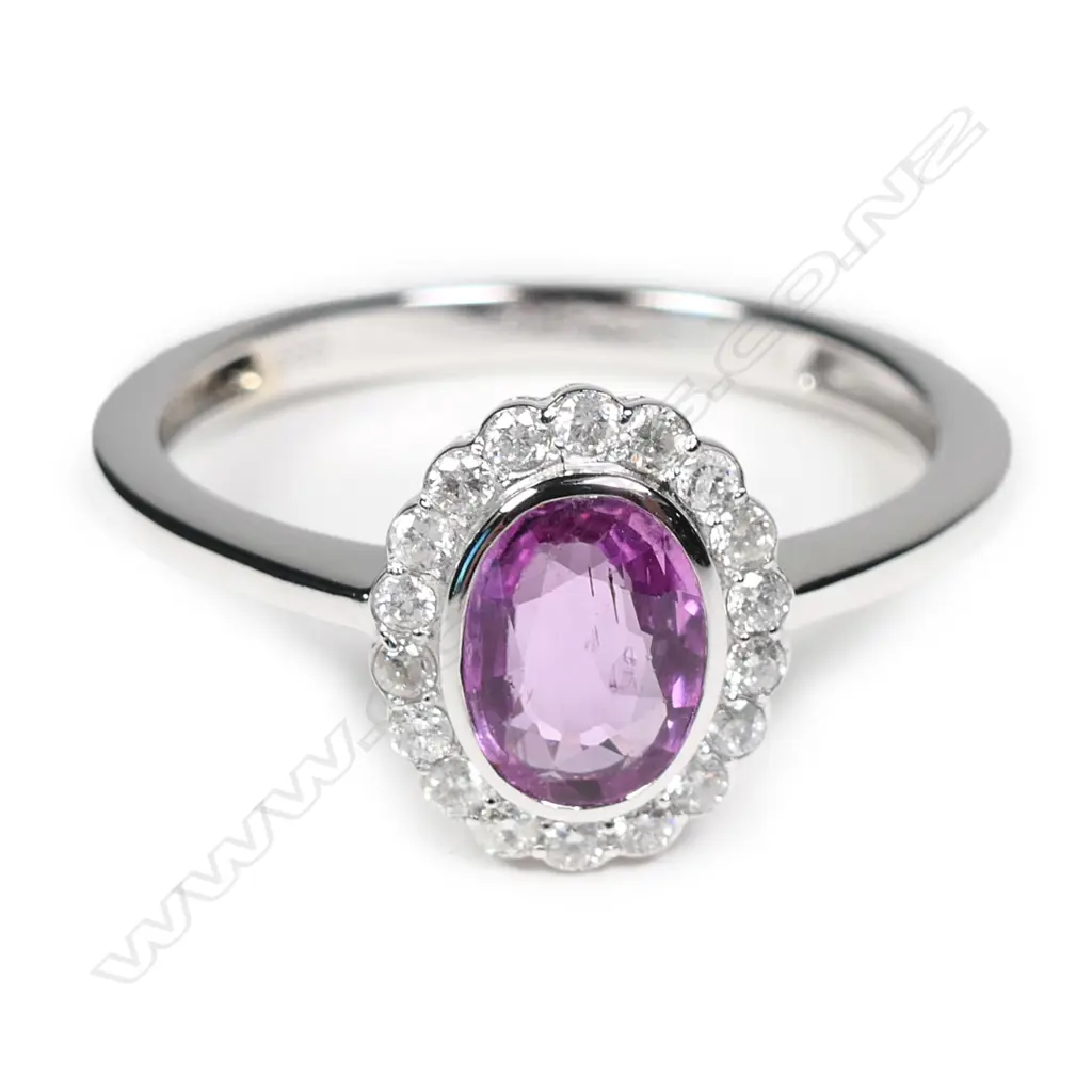 A 14ct white gold sapphire and diamond ring Image 1++