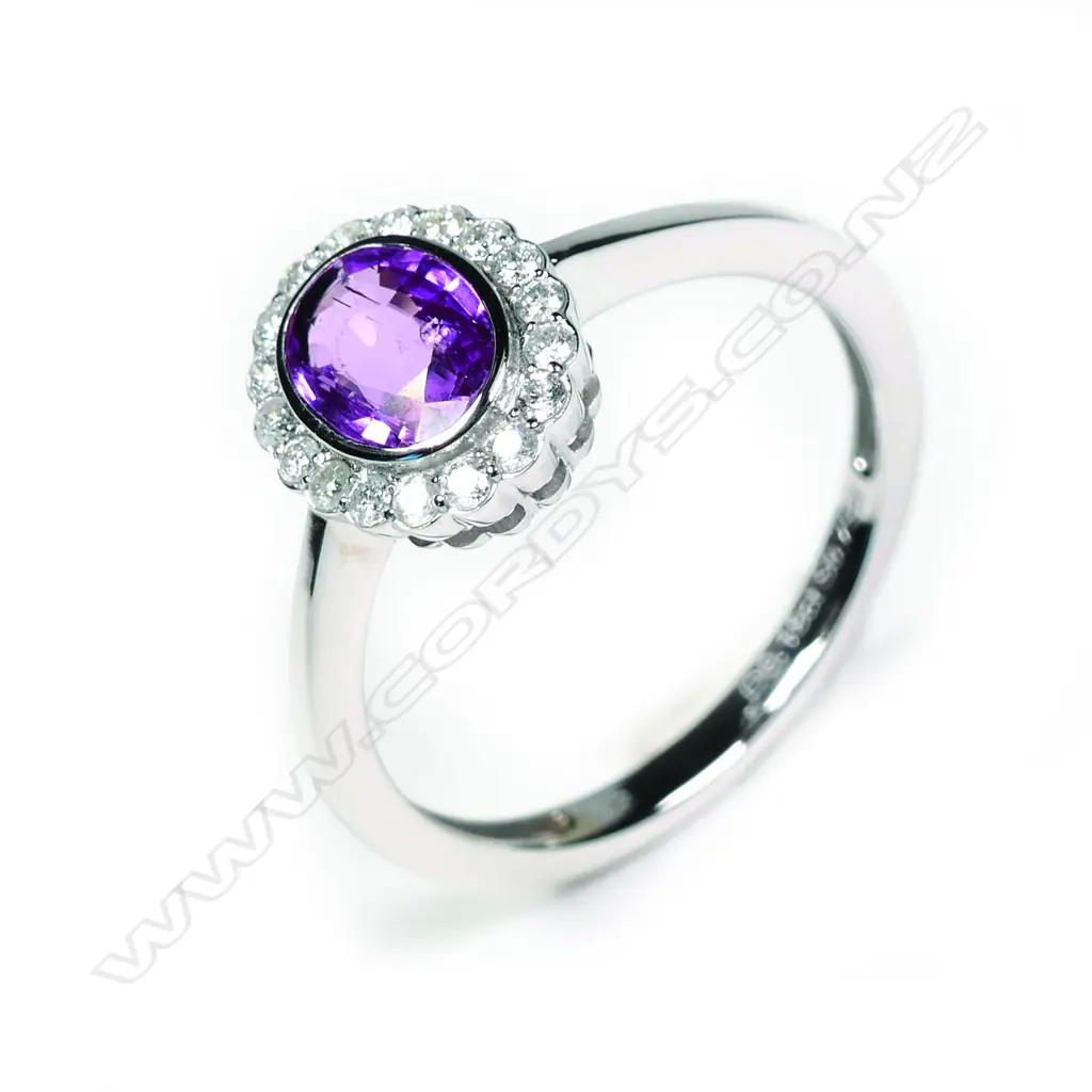A 14ct white gold sapphire and diamond ring Image 1++