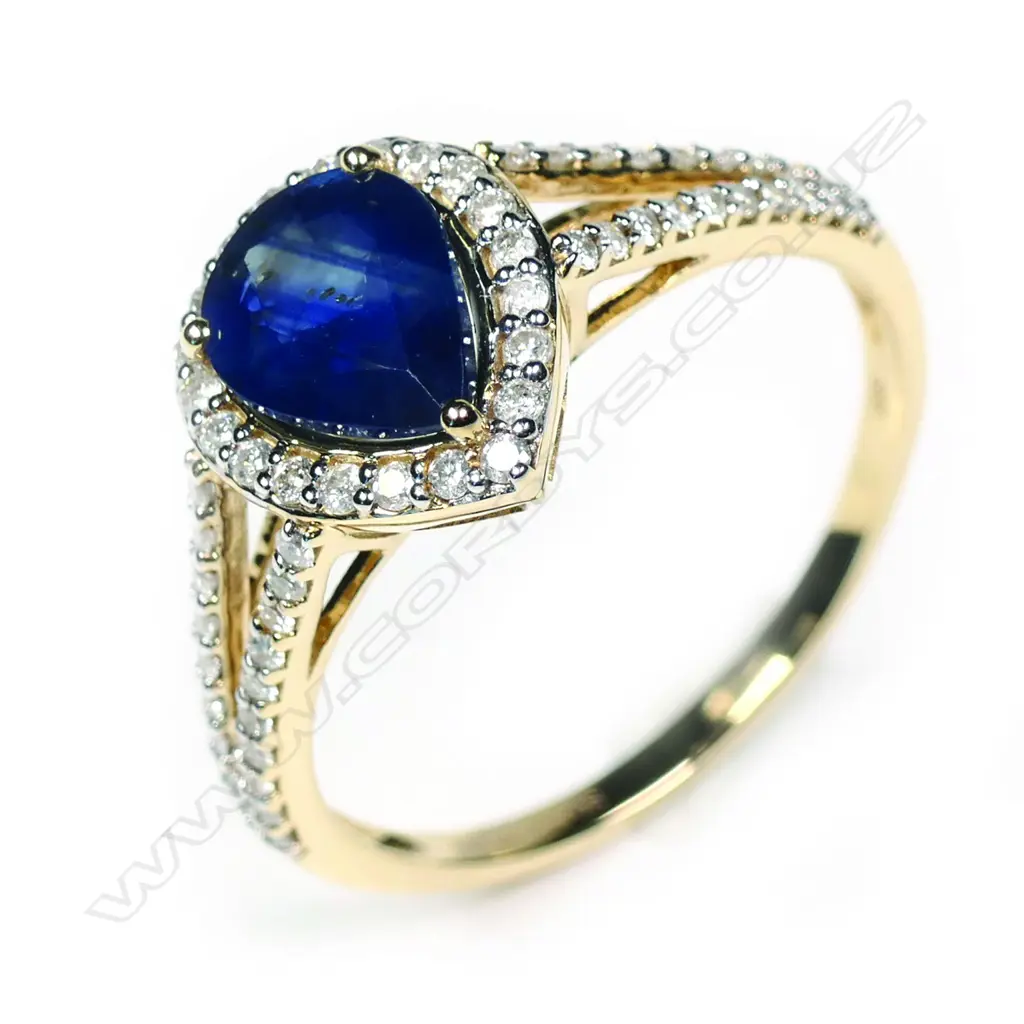 A 14ct yellow gold sapphire and diamond halo ring Image 1++