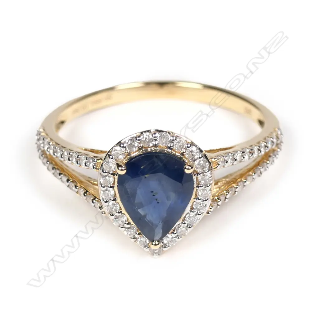 A 14ct yellow gold sapphire and diamond halo ring Image 1++