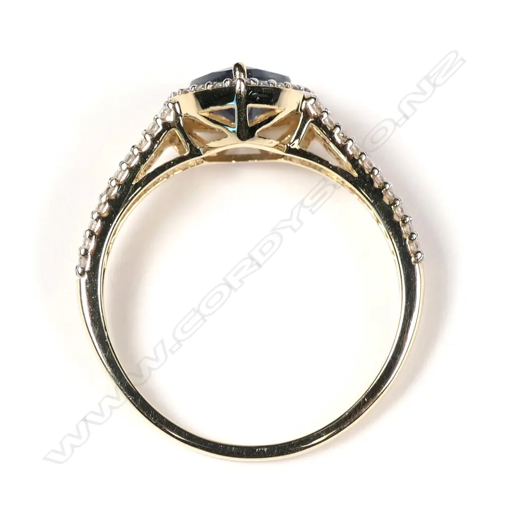 A 14ct yellow gold sapphire and diamond halo ring Image 1++